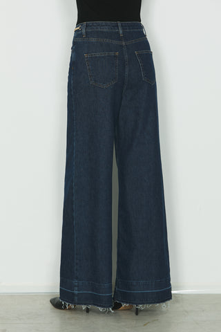 Jeans REECE vita alta 5ts con fondo sfrangiato più catena logo in blue denim