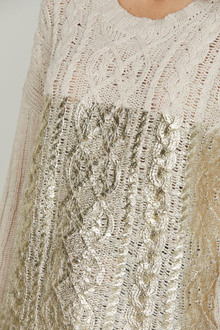 Maglia PSYLLOS manica lunga over con lavorazione trecce più spalmatura gold