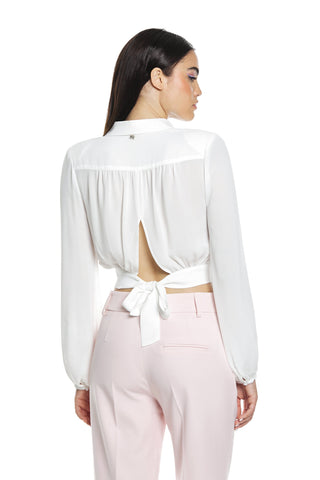 ALCYONE blouse with long sleeves, crisscross neckline and chain necklace and bow on the back