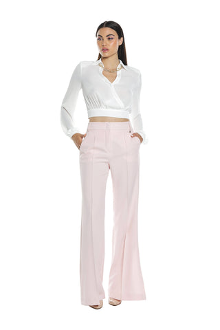 ALCYONE blouse with long sleeves, crisscross neckline and chain necklace and bow on the back