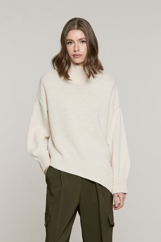 Maglia LYS collo alto taglio asimmetrico
