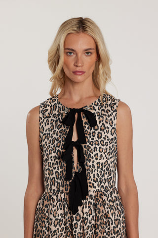 Abito SHIELDS corto smanicato con apertura sul seno più fiocchi più applicazioni pietre fantasia animalier