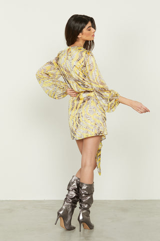 AAMIR_A short long-sleeved dress with ruffle. More drop, more skirt with animalier sash, more lure