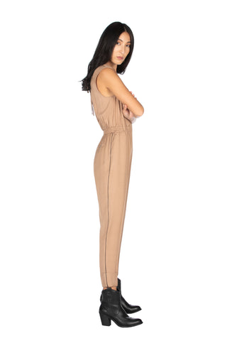 LONDON sleeveless jumpsuit with deep crossover neckline, elastic waist and pleat at the bottom 