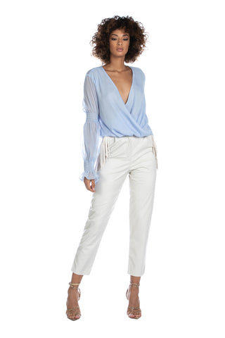 LUCANIA mid-rise faux leather trousers with French pockets and fringes